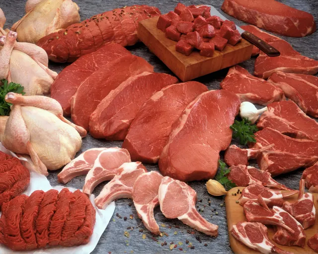 A variety of fresh raw meats including beef, chicken, and sausages.